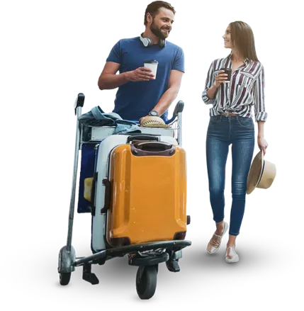 Couple with a luggage trolley at the airport